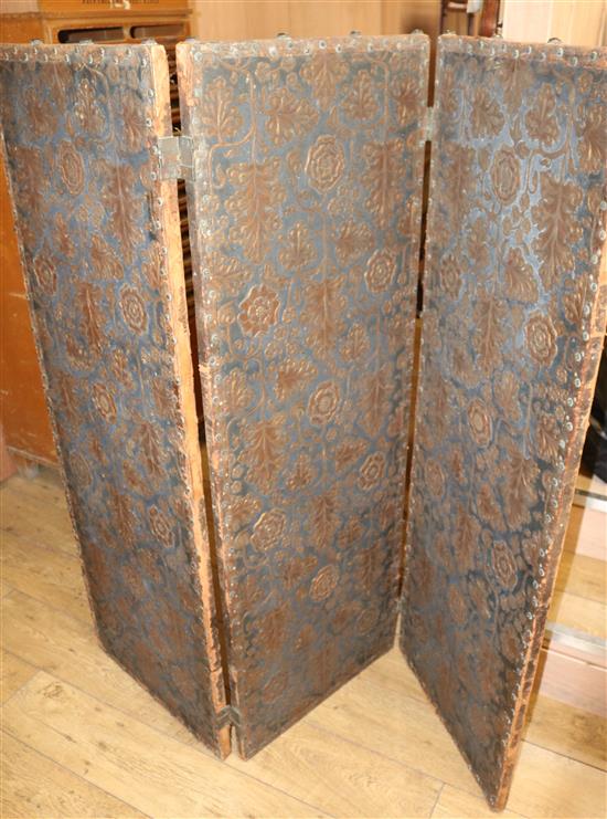 A Spanish leather three fold screen overall W.159cm